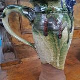Enameled stoneware pitcher signed