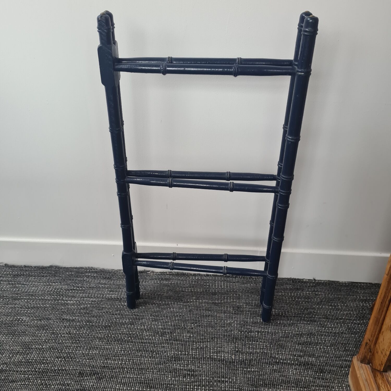 Wooden towel rail painted navy blue