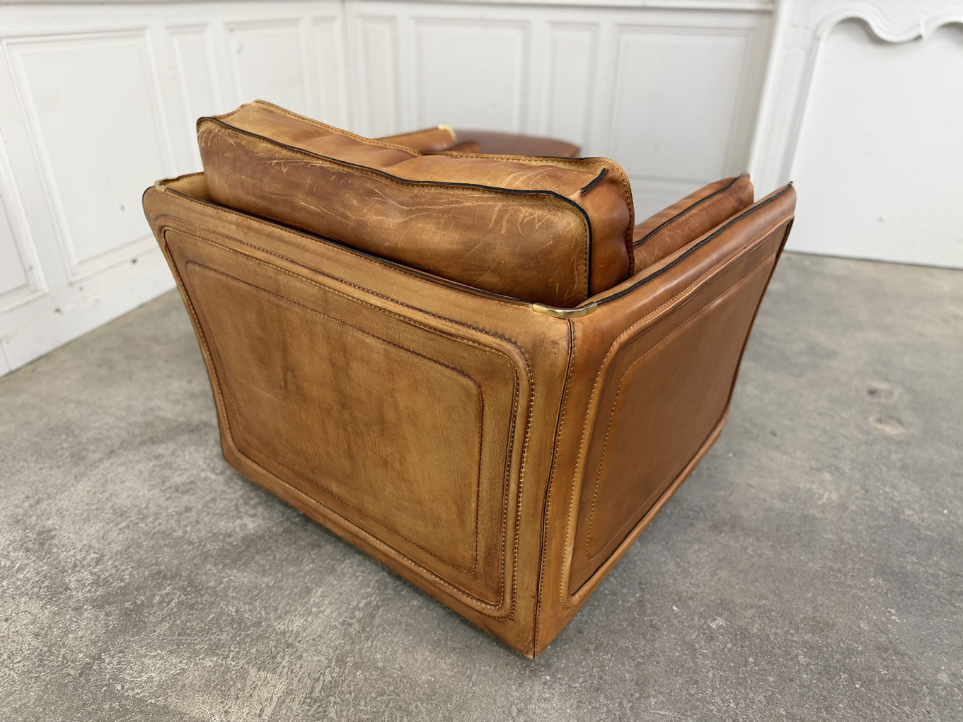 Club armchair and its ottoman 1980s