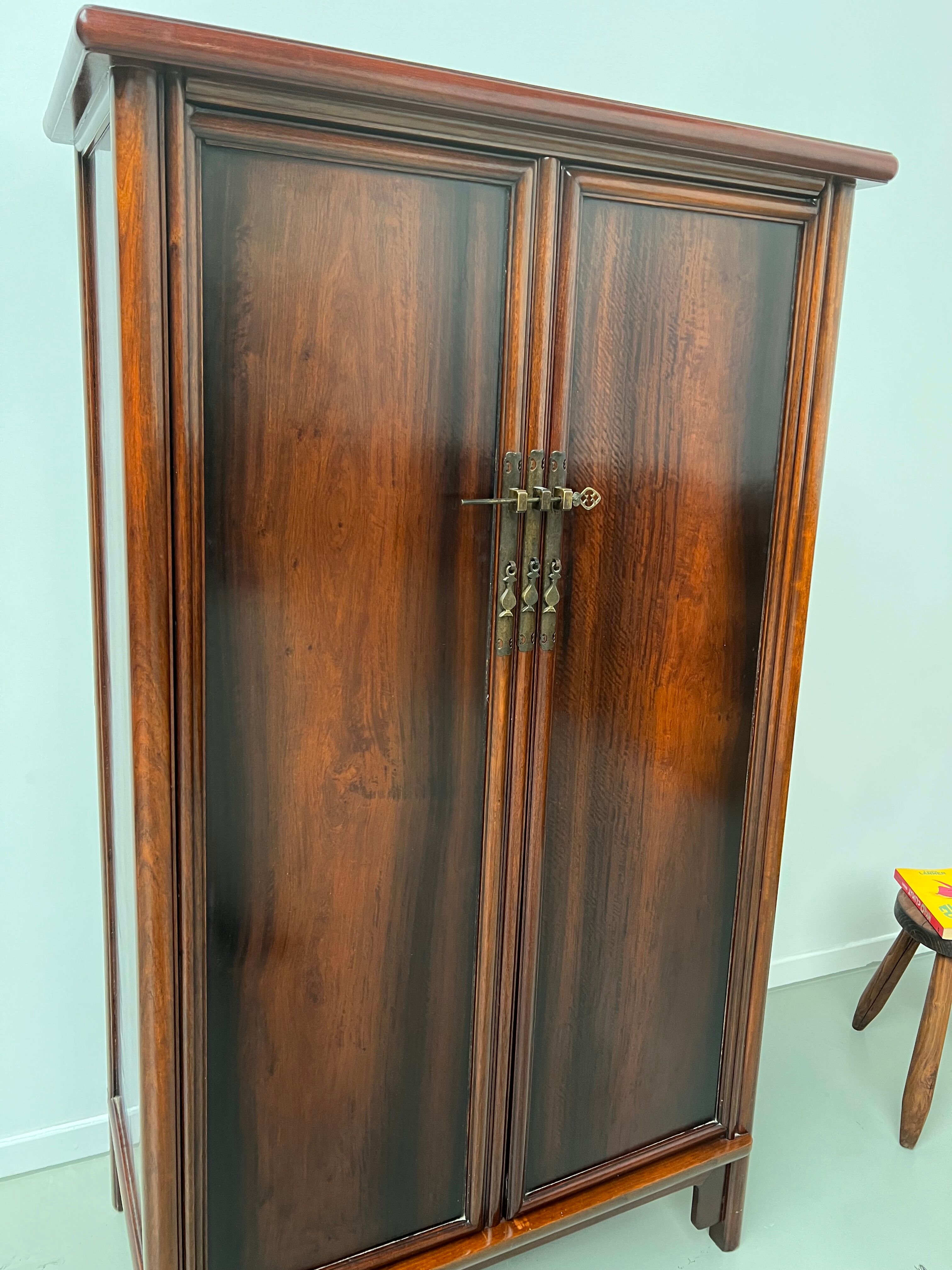 Chinese trapezoidal roller cabinet, made of rosewood.