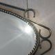 Mid-century modern iron mirror, brutalist, vintage organic, thick sixties.