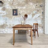 Vintage farm table with spindle legs.