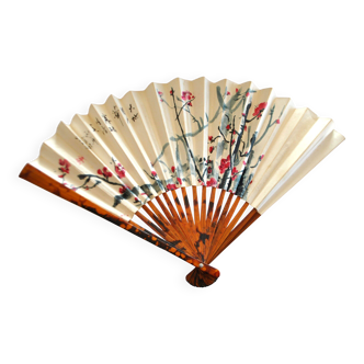 Vintage bamboo fan with floral decoration from China.