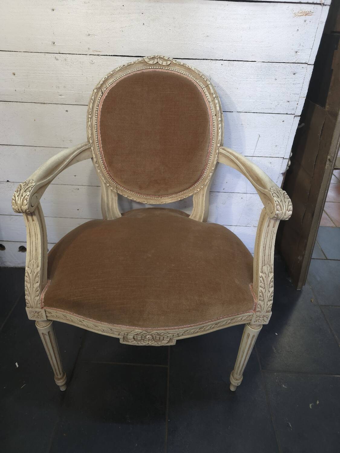Louis XVI style bergère armchair in patinated wood