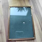 Vintage photo frame in gold and decorated metal