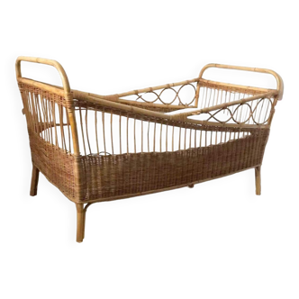 Vintage rattan and wicker baby bed, old children's cradle furniture