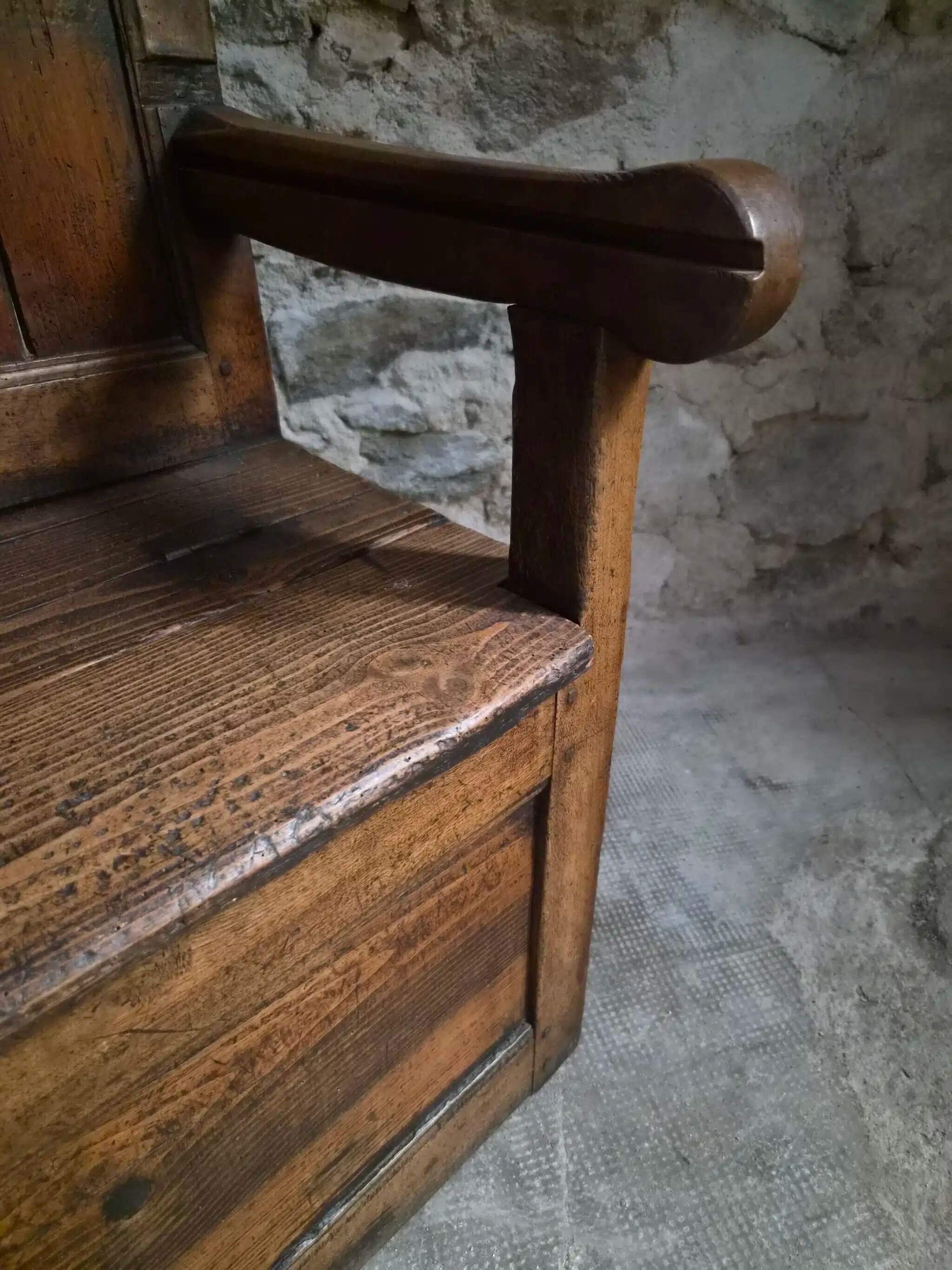 Rustic French antique storage bench from the 18th century in walnut and pine.