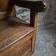 Rustic French antique storage bench from the 18th century in walnut and pine.