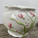 White ceramic pot cache in old flower slip