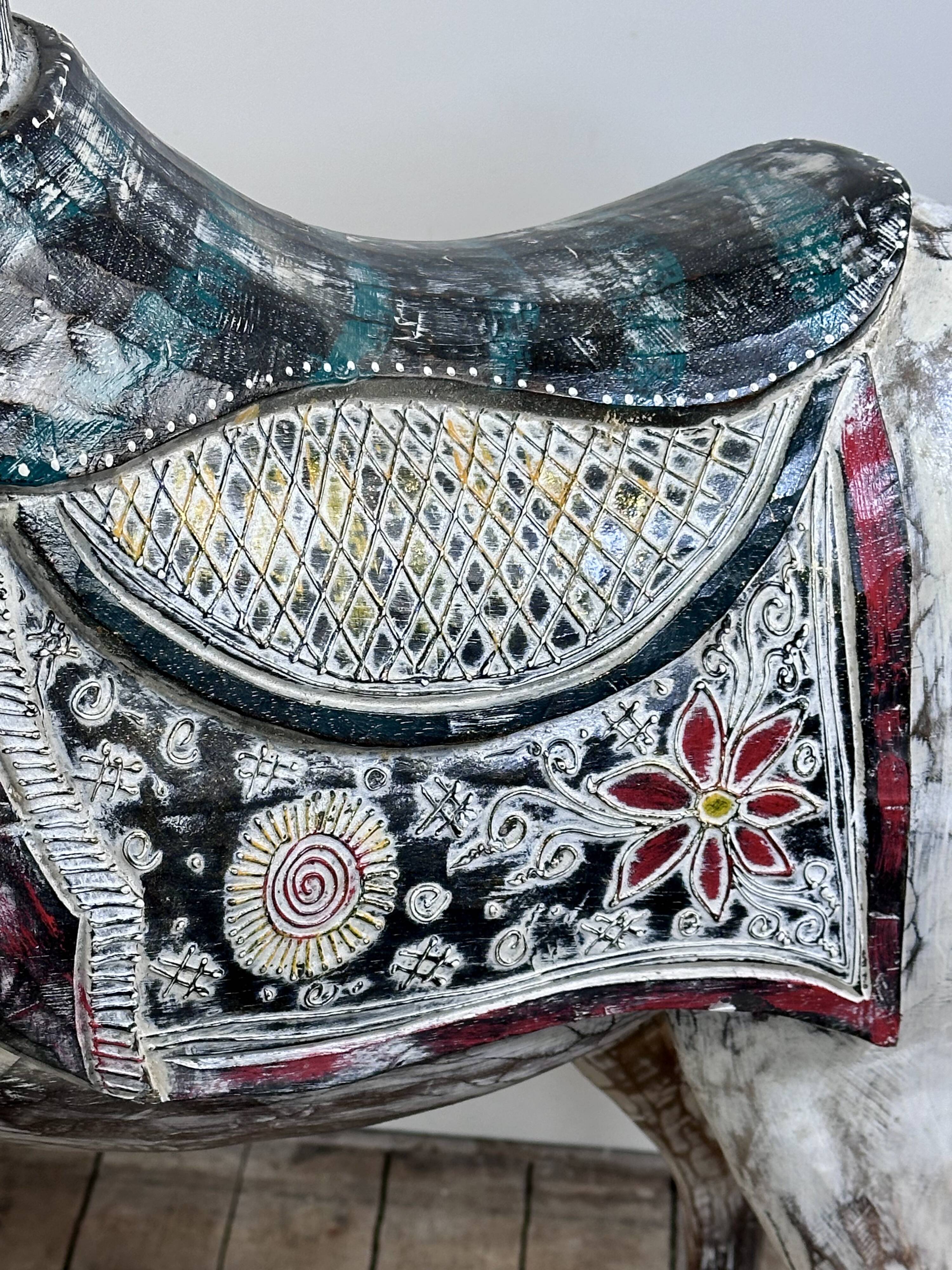 Carved and patinated wooden carousel horse