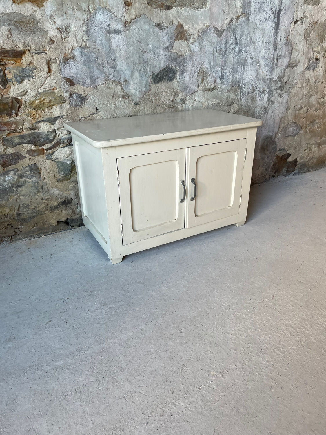 Antique white patinated low cabinet