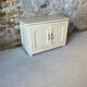 Antique white patinated low cabinet