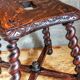 Antique stool in turned and carved solid wood