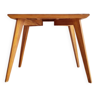 Coffee table with compass legs and inlaid top