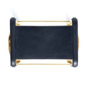 Pair of blue metal and brass stools without a backrest.