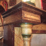 19th century wooden fireplace, faux marble paint. Can act as a console.