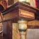 19th century wooden fireplace, faux marble paint. Can act as a console.