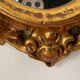 Miroir rocaille en résine dorée