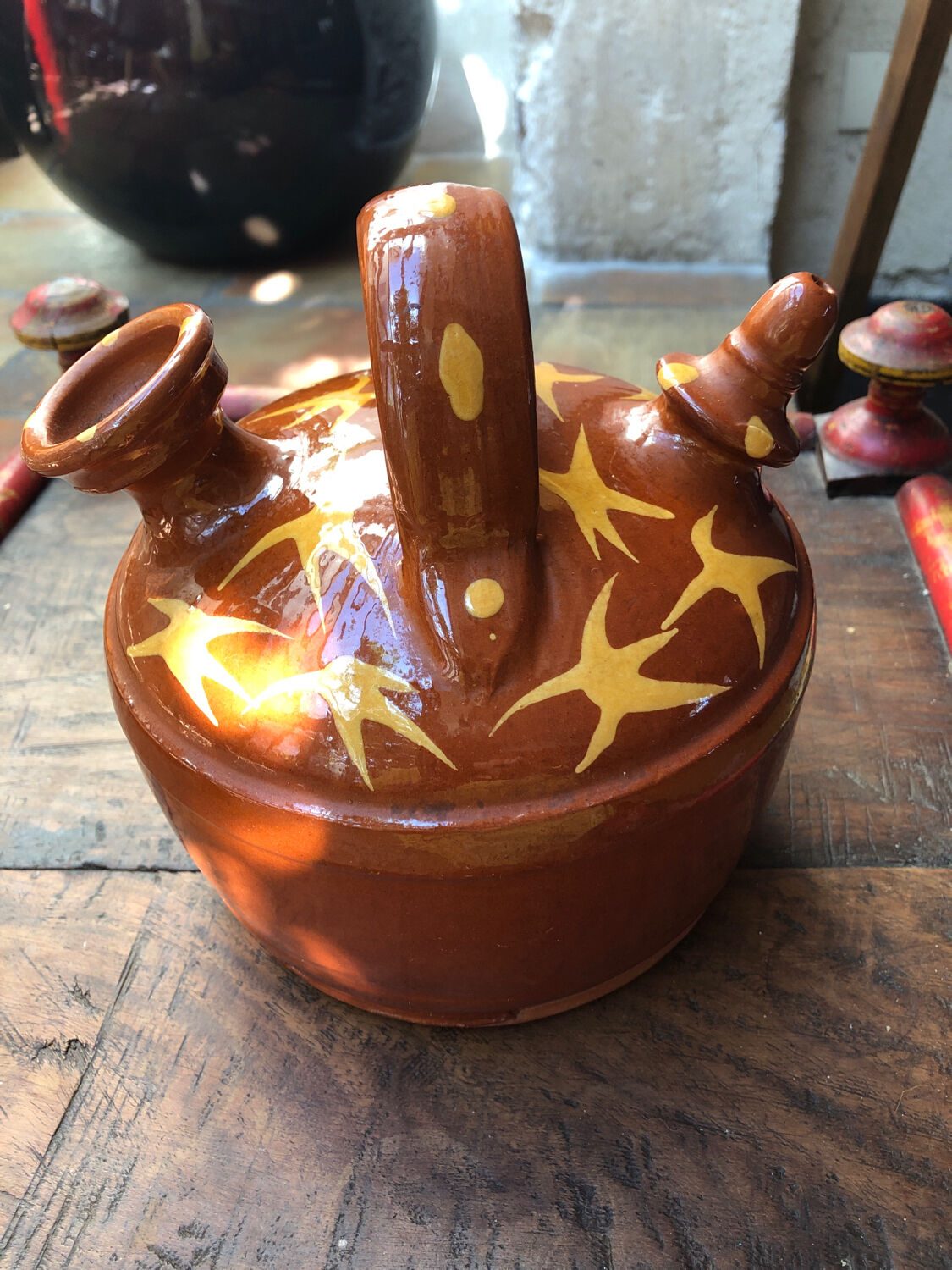Orange glazed terracotta gargoulette