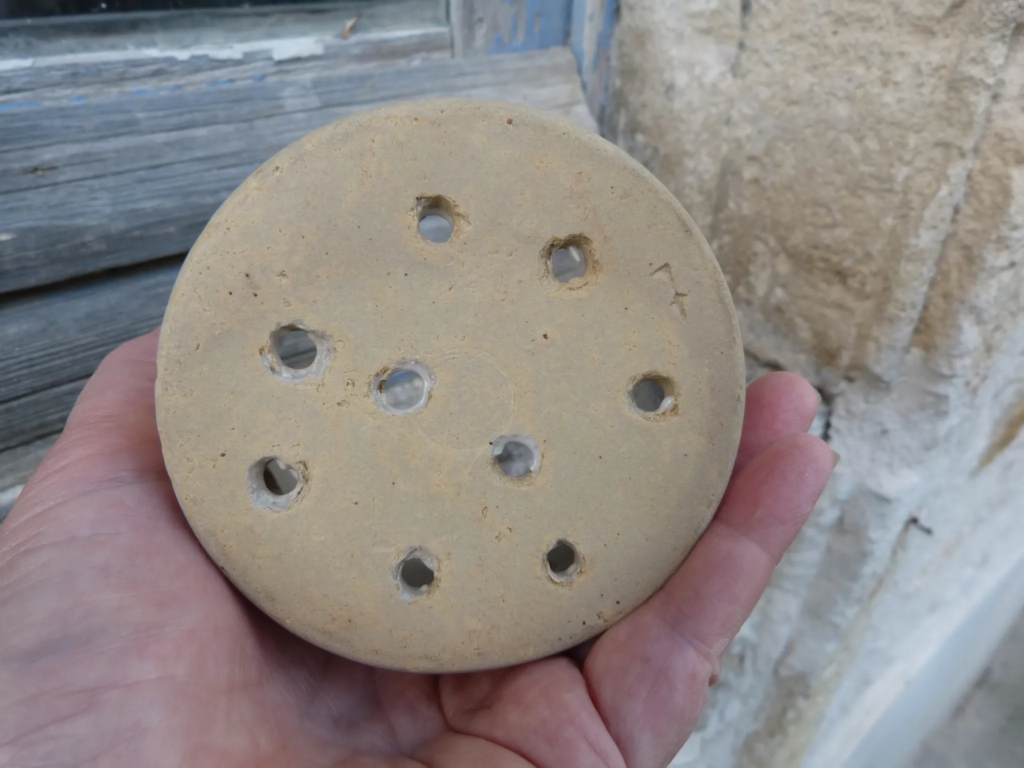 Beige stoneware cheese drainer