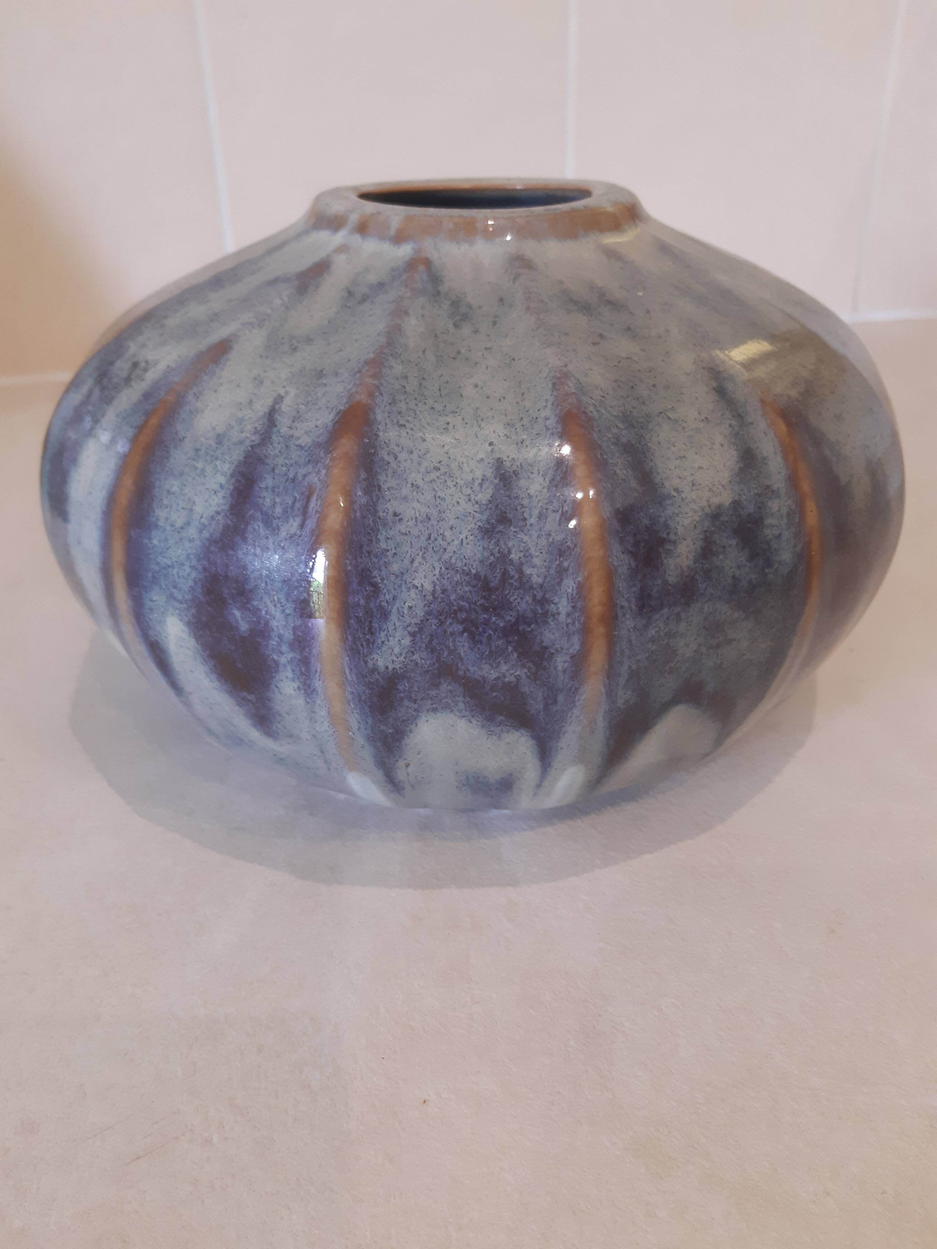 Globe vase, narrow neck, wide body.