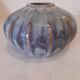 Globe vase, narrow neck, wide body.