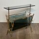 Brass magazine rack and blue-tinted glasses