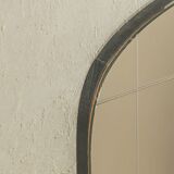 Classic 1950s mirror in black lacquered wooden frame with two brass elements