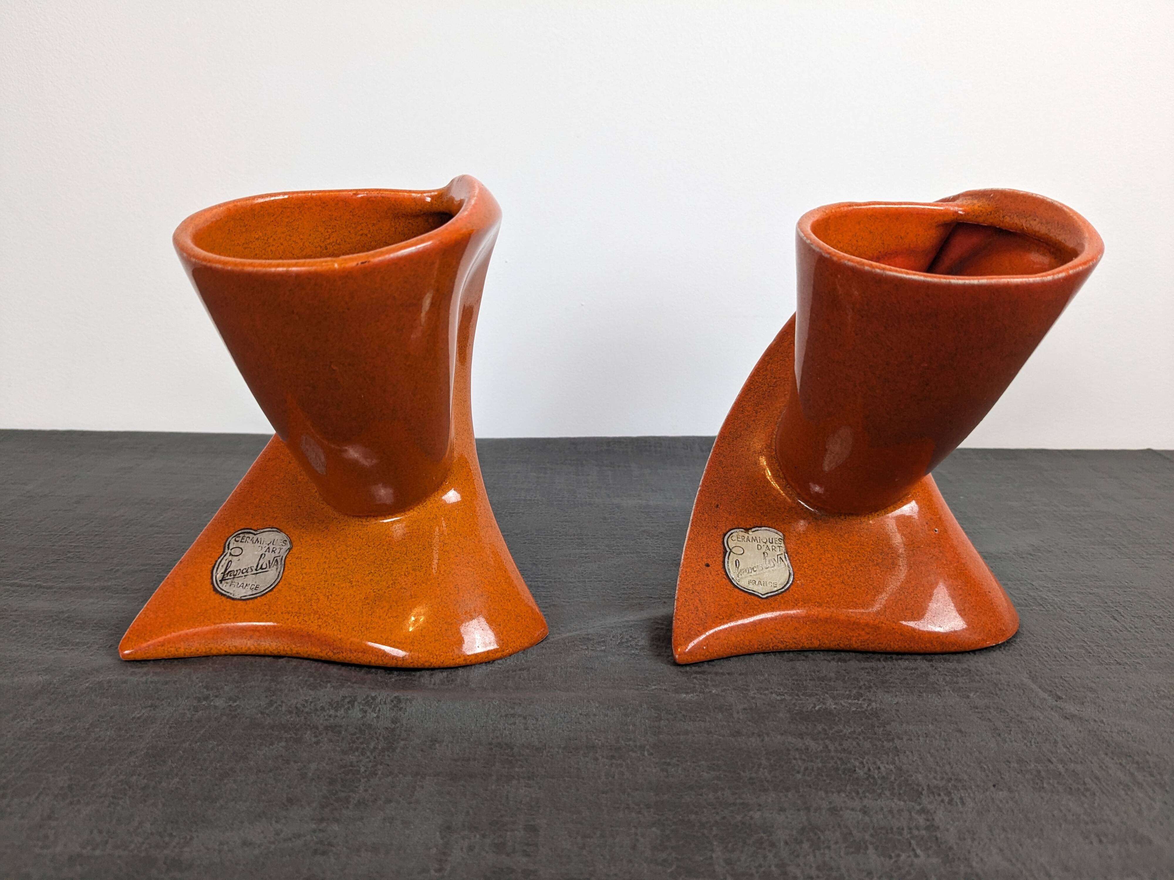 Pair of orange ceramic flower girls by Francis Lovas