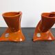 Pair of orange ceramic flower girls by Francis Lovas