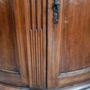 Antique demi-lune cabinet in walnut, late 18th century, French château.