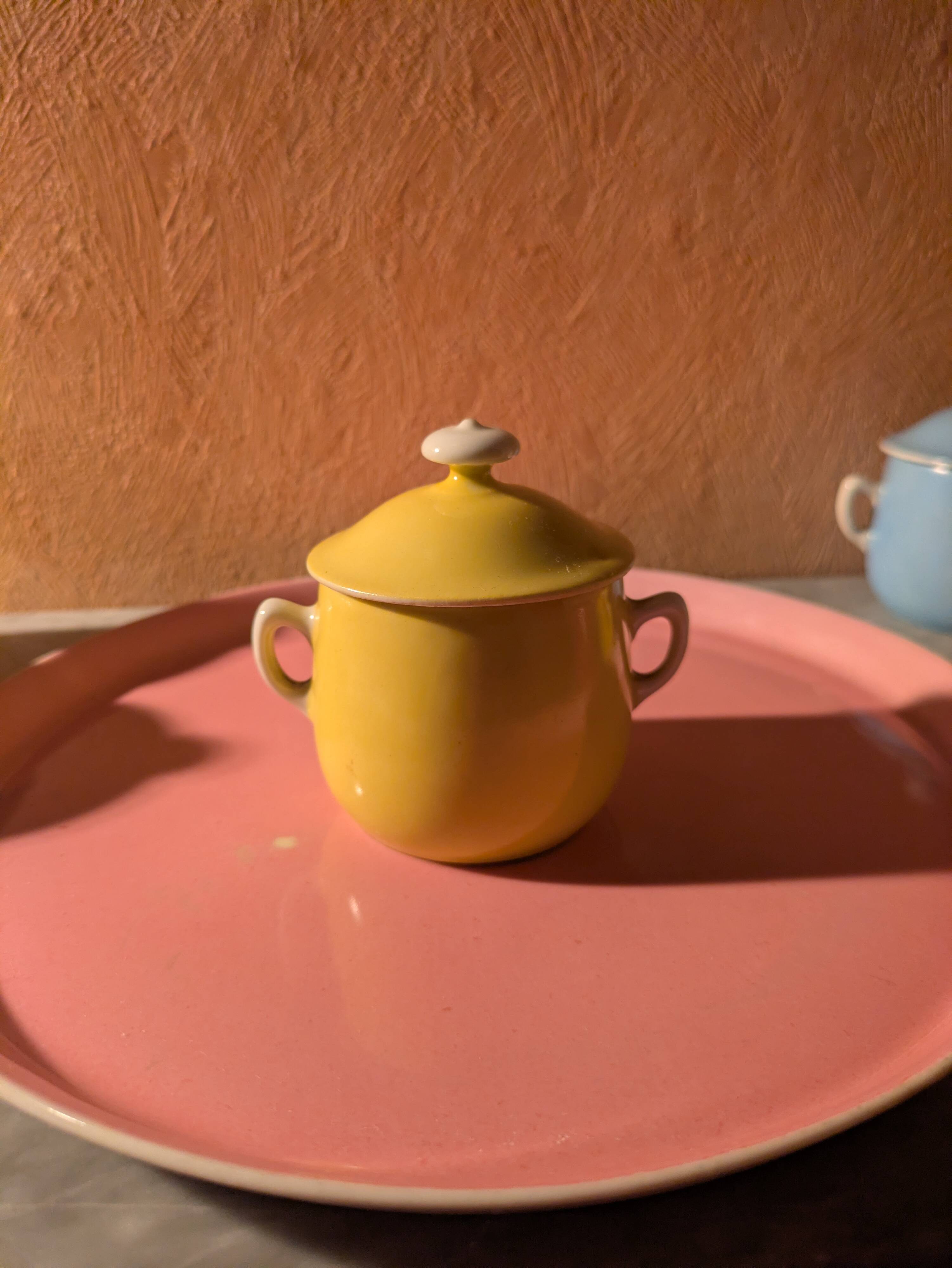 6 small porcelain cream pots from Limoges with a tray.