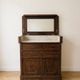 Antique wooden and marble dressing table from the early 20th century.