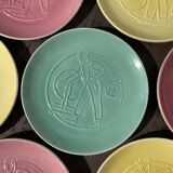 7 assiettes multicolore métiers anciens en porcelaine de Nyon