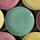 7 assiettes multicolore métiers anciens en porcelaine de Nyon