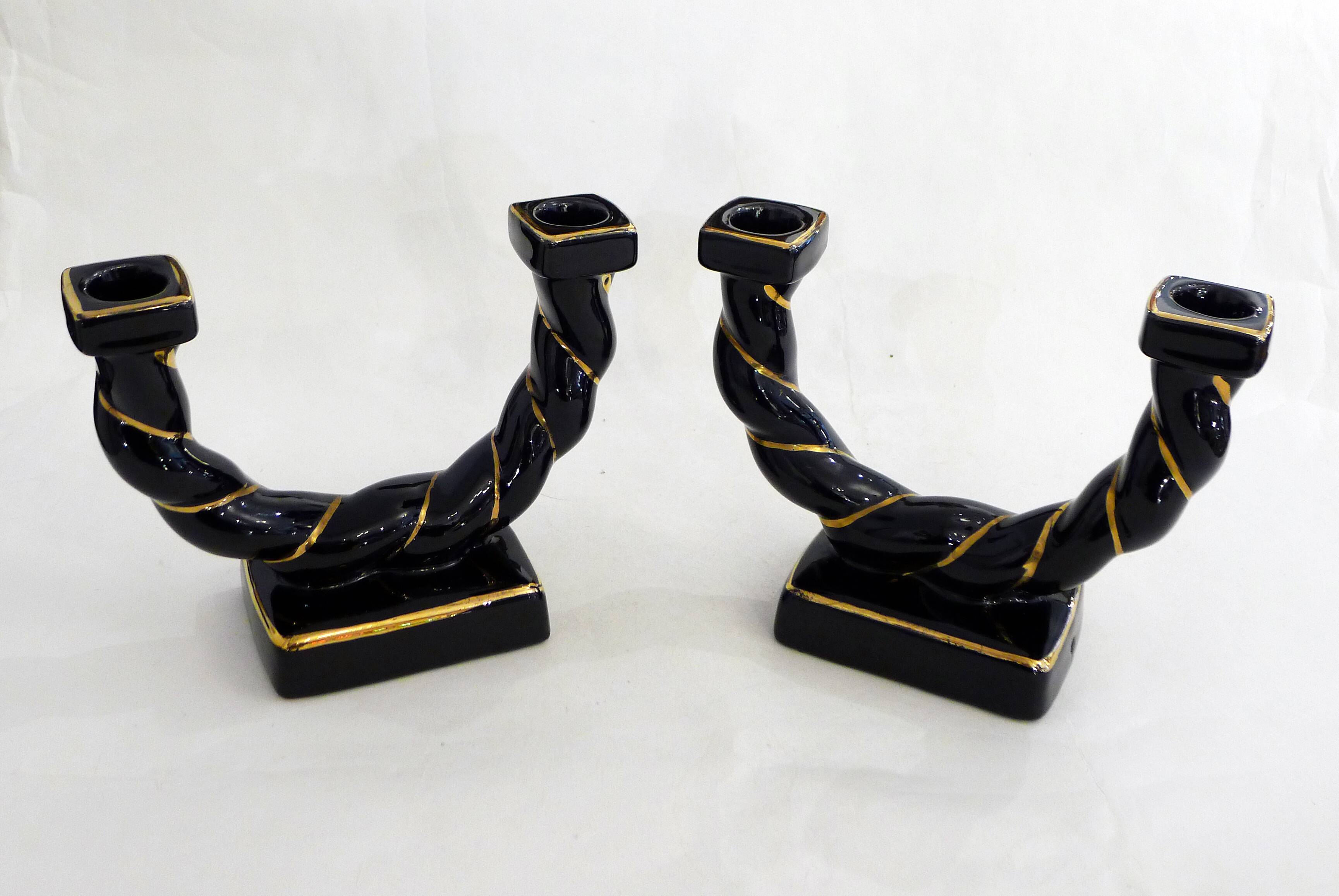 Pair of earthenware braided rope candlesticks