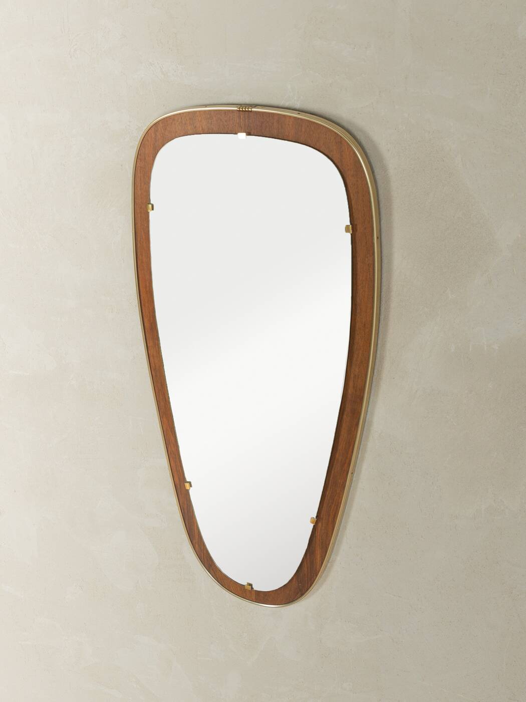 Wonderful 1950s mirror on a teak wood panel with brass frame. Made in Germany