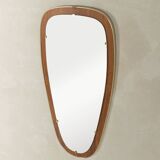 Wonderful 1950s mirror on a teak wood panel with brass frame. Made in Germany