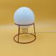 Red metal lamp with opaline globe from the 70s and 80s.