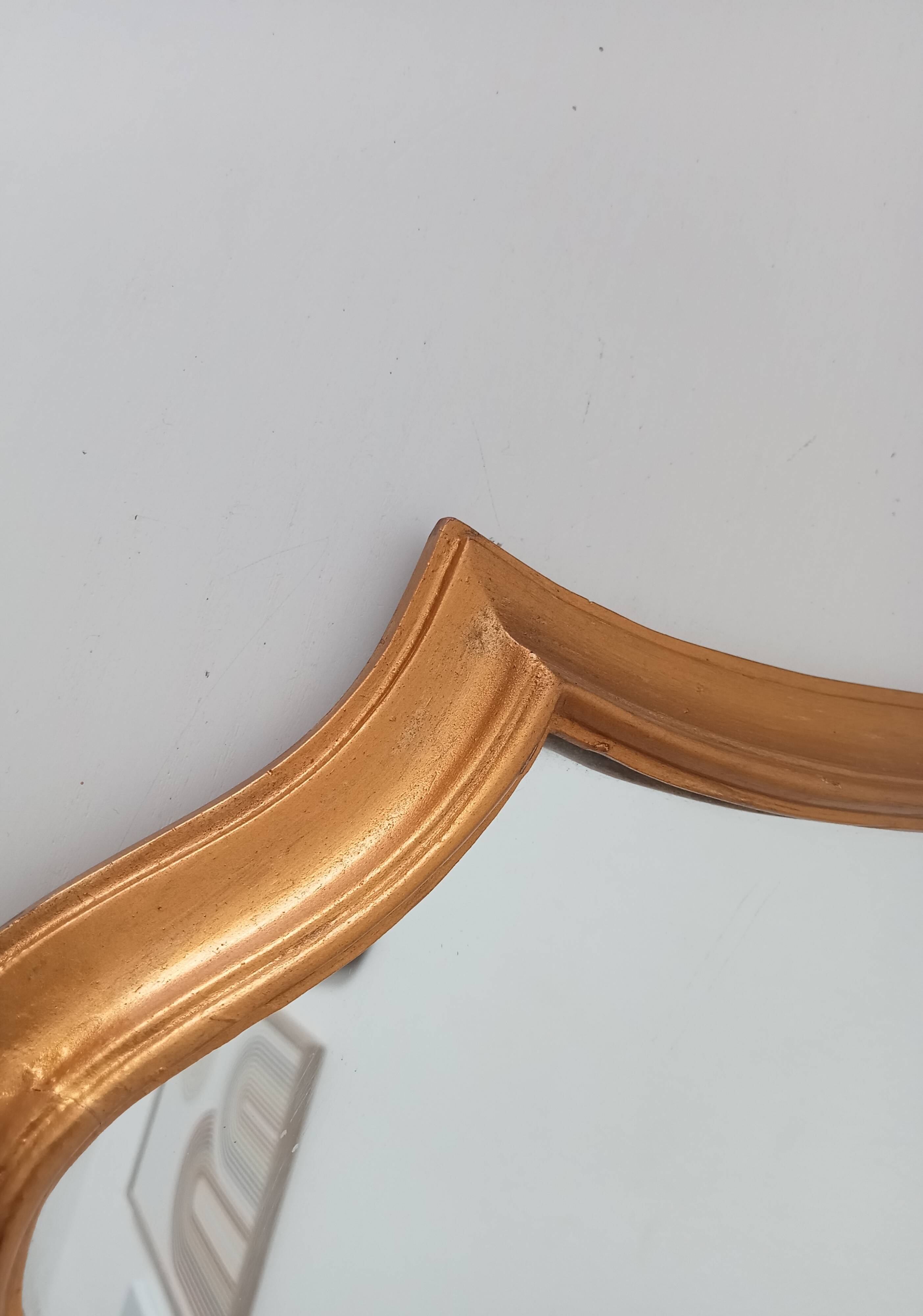 Vintage baroque mirror in gilded wood