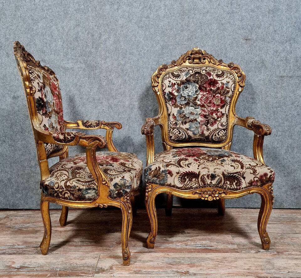 Pair of Louis XV style Baroque armchairs in gilded and carved wood circa 1900