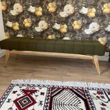 Wooden bench and green fabric