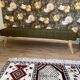 Wooden bench and green fabric