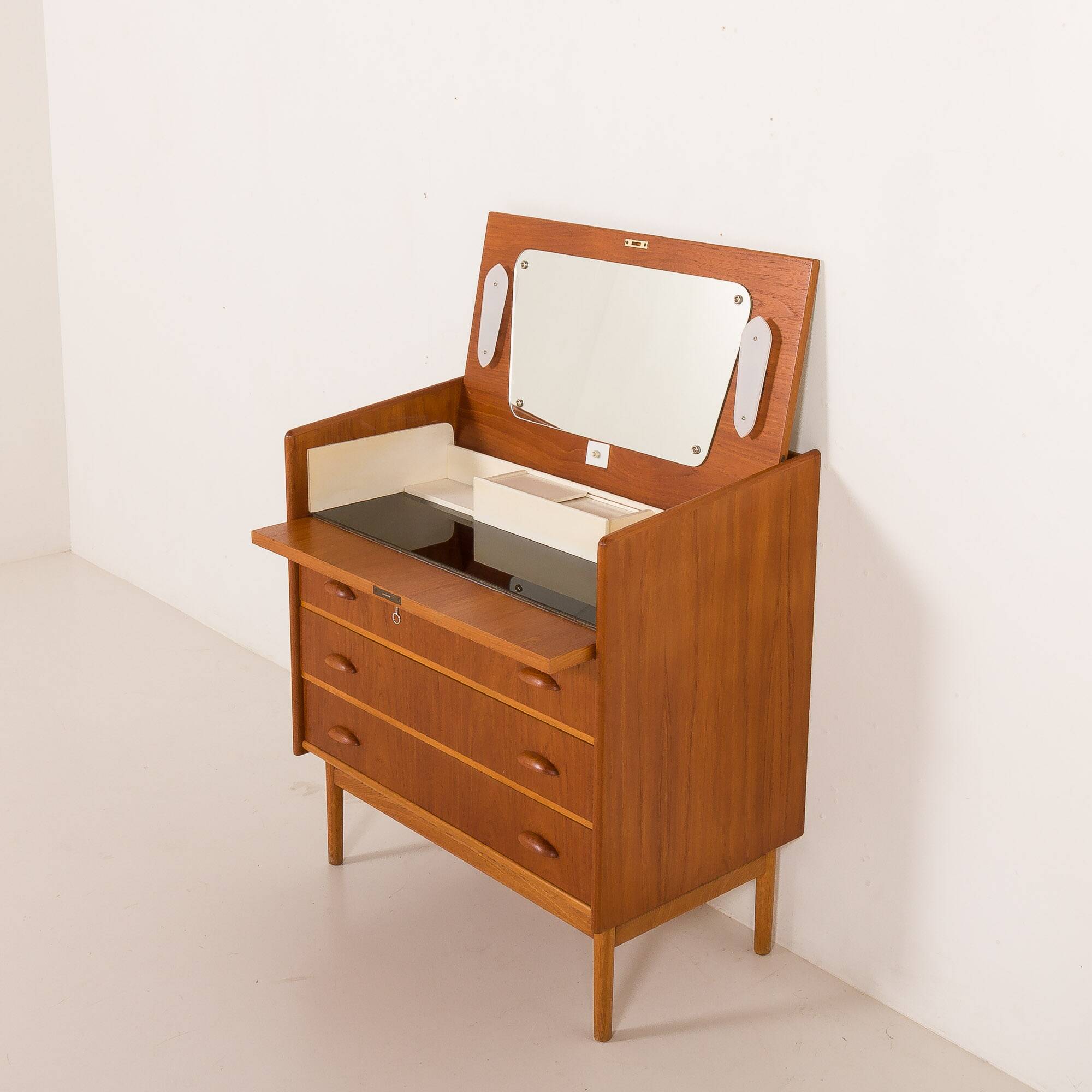 Danish teak dresser with hidden vanity and lights, 1960s