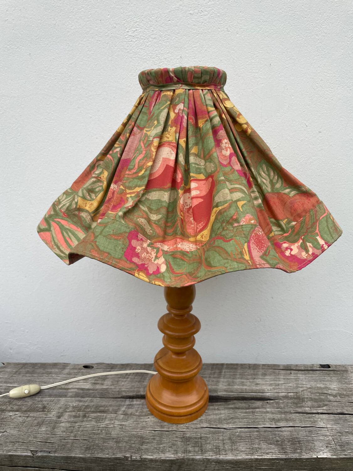 Turned wood lamp with flower shade