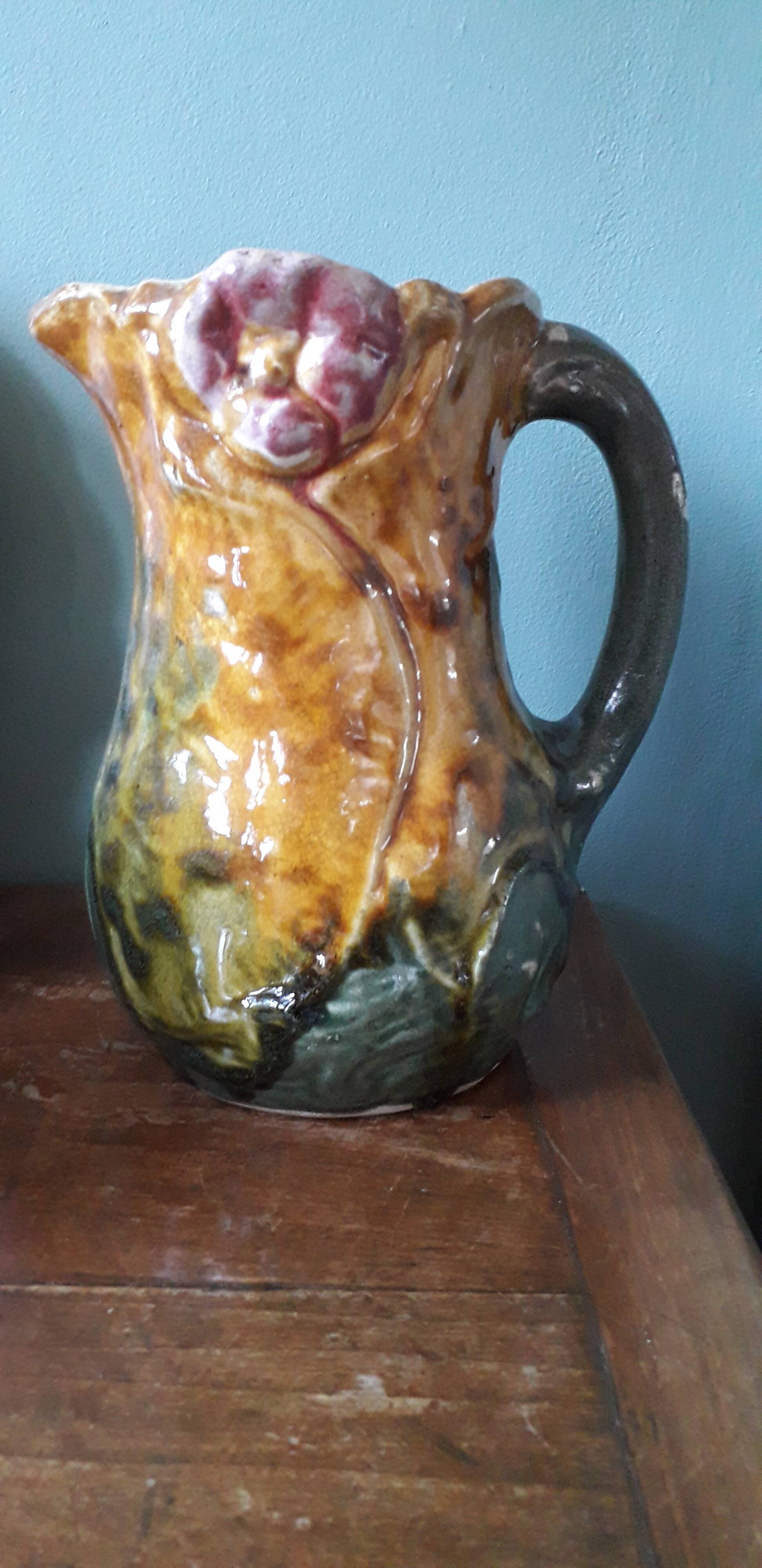 Vintage slip pitcher with floral decoration