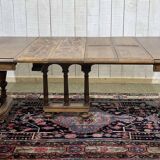 Henri II walnut table from the early 20th century with extensions.