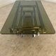 Table basse Space âge années 70 métal tubulaire et verre fumé design italien