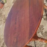 Old extendable round table in fruit wood with folding sides