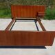 Vintage bed in teak with integrated bedside table.